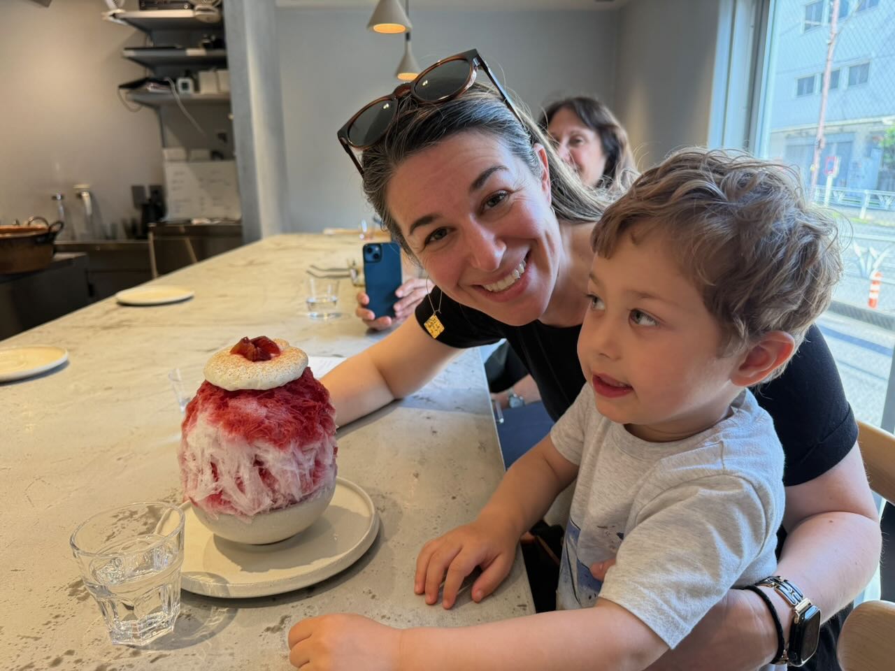 Curio getting ready to eat shaved ice